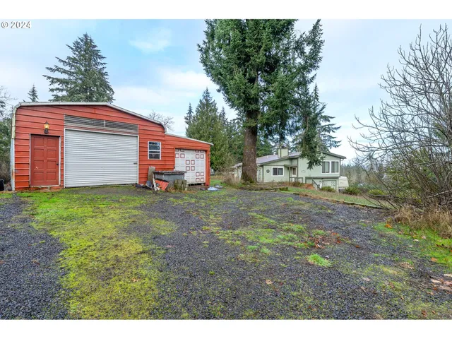 a backyard of a house with a garden and deck