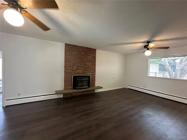 a view of room with window and a ceiling fan