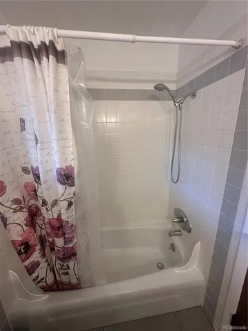 a bathroom with a sink toilet and mirror