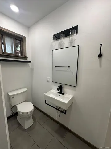 a bathroom with a sink a toilet and a bathtub