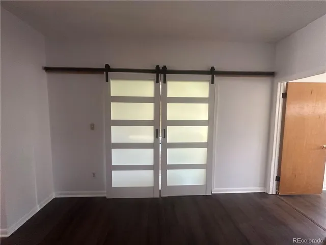 a bathroom with a glass shower door