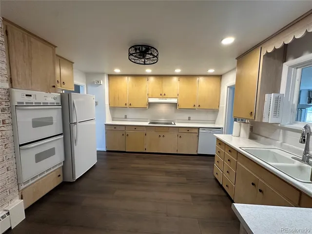 a spacious bathroom with a double vanity sink and mirror