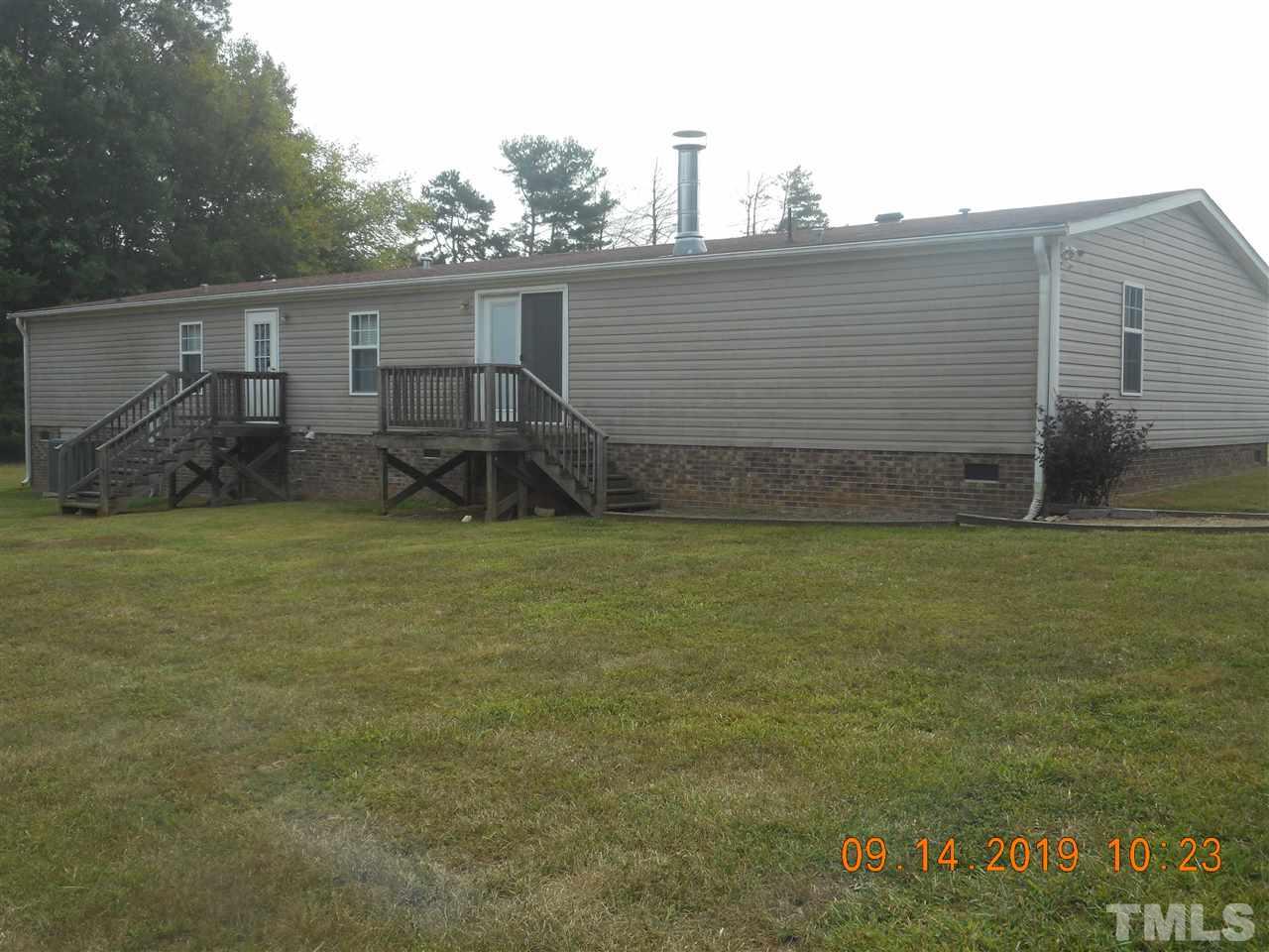 1335 Thomas Store Road Timberlake, NC 27583 - Photo 2 of 13 a backyard of a house