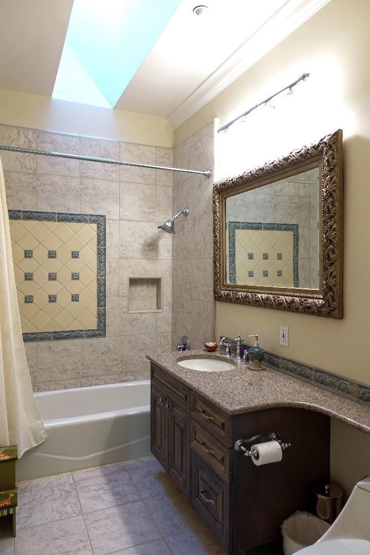 293 Sleeper Avenue Mountain View, CA 94040 - Photo 6 of 17 a bathroom with a granite countertop sink a mirror and bathtub