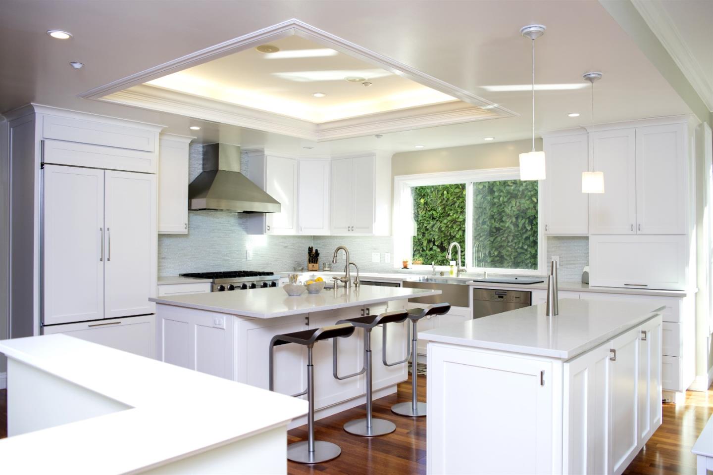 293 Sleeper Avenue Mountain View, CA 94040 - Photo 7 of 17 a kitchen that has a sink a stove and a table in it