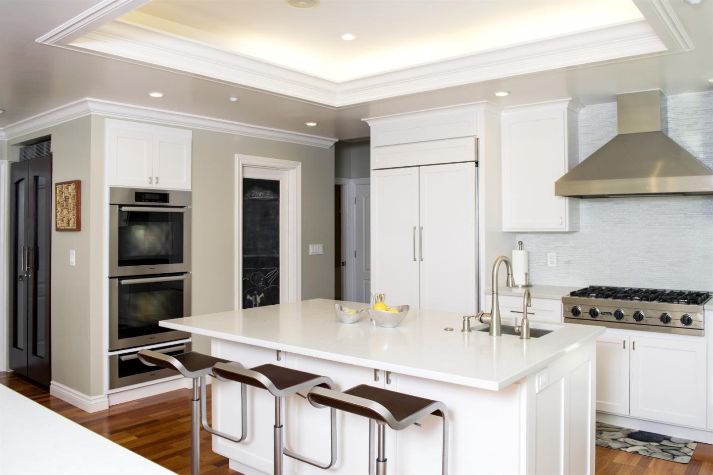 293 Sleeper Avenue Mountain View, CA 94040 - Photo 8 of 17 a kitchen with stainless steel appliances a sink a stove and cabinets