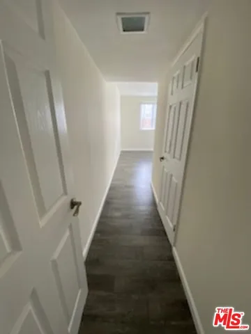 a bathroom with a sink vanity and a mirror