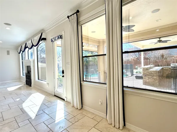 a large kitchen with stainless steel appliances granite countertop a stove and a sink