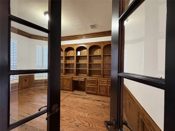 a living room with furniture windows and wooden floor