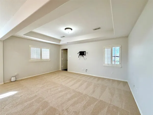 a view of a livingroom with a ceiling fan and window
