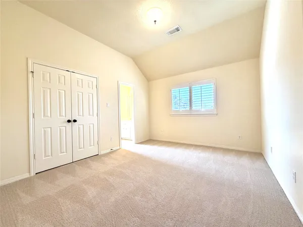 a spacious bathroom with a shower sink and mirror