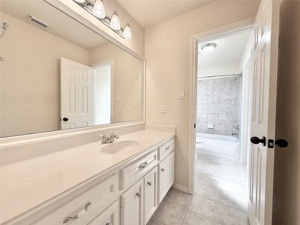 a bathroom with a sink toilet a mirror and vanity