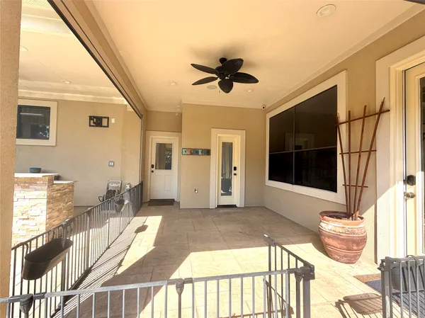 a large kitchen with kitchen island a large window in it
