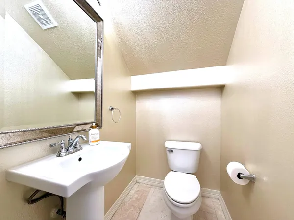 a bathroom with a sink vanity and a mirror