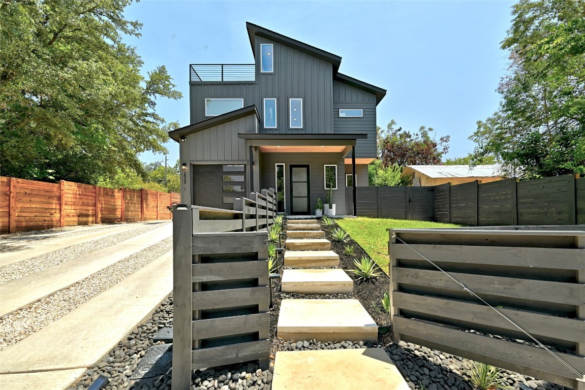 2909 Kuhlman Avenue, Unit 1 Austin, TX 78702 - Photo 1 of 40 a front view of a house with a yard