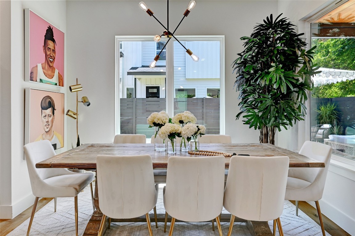 2909 Kuhlman Avenue, Unit 1 Austin, TX 78702 - Photo 11 of 40 a view of a dining room with furniture and chandelier