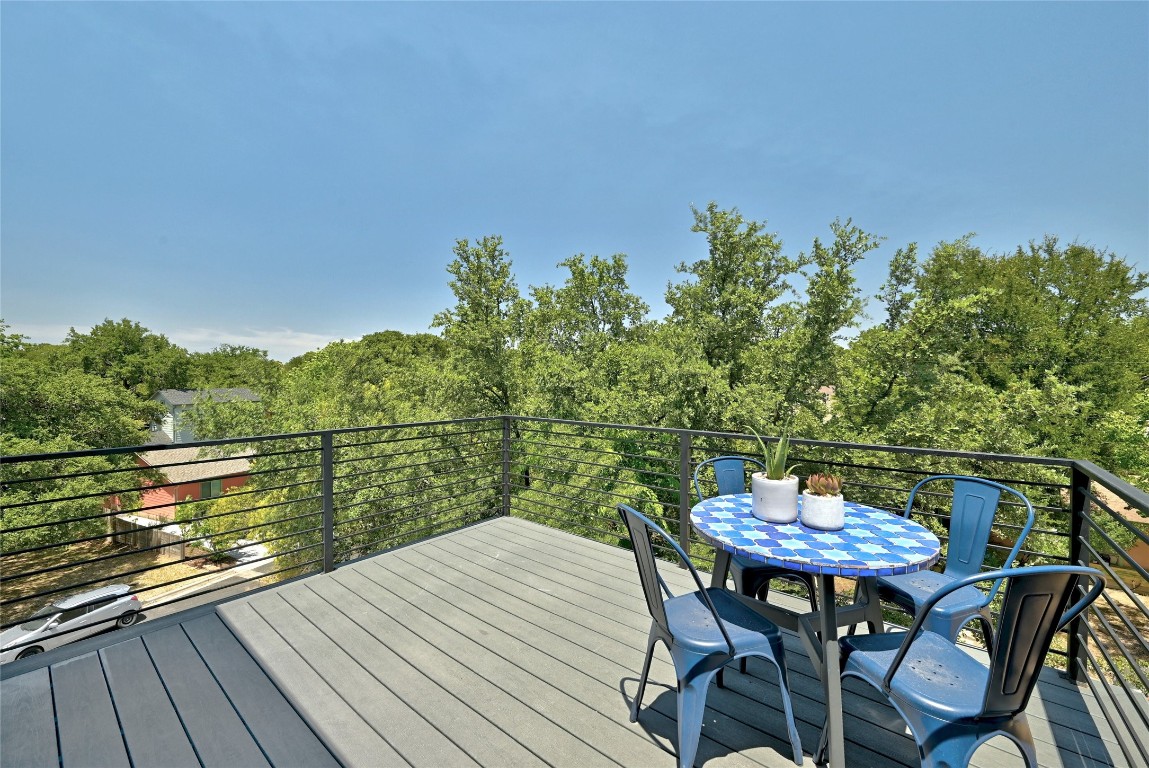 2909 Kuhlman Avenue, Unit 1 Austin, TX 78702 - Photo 35 of 40 a view of a balcony with two chairs and a table