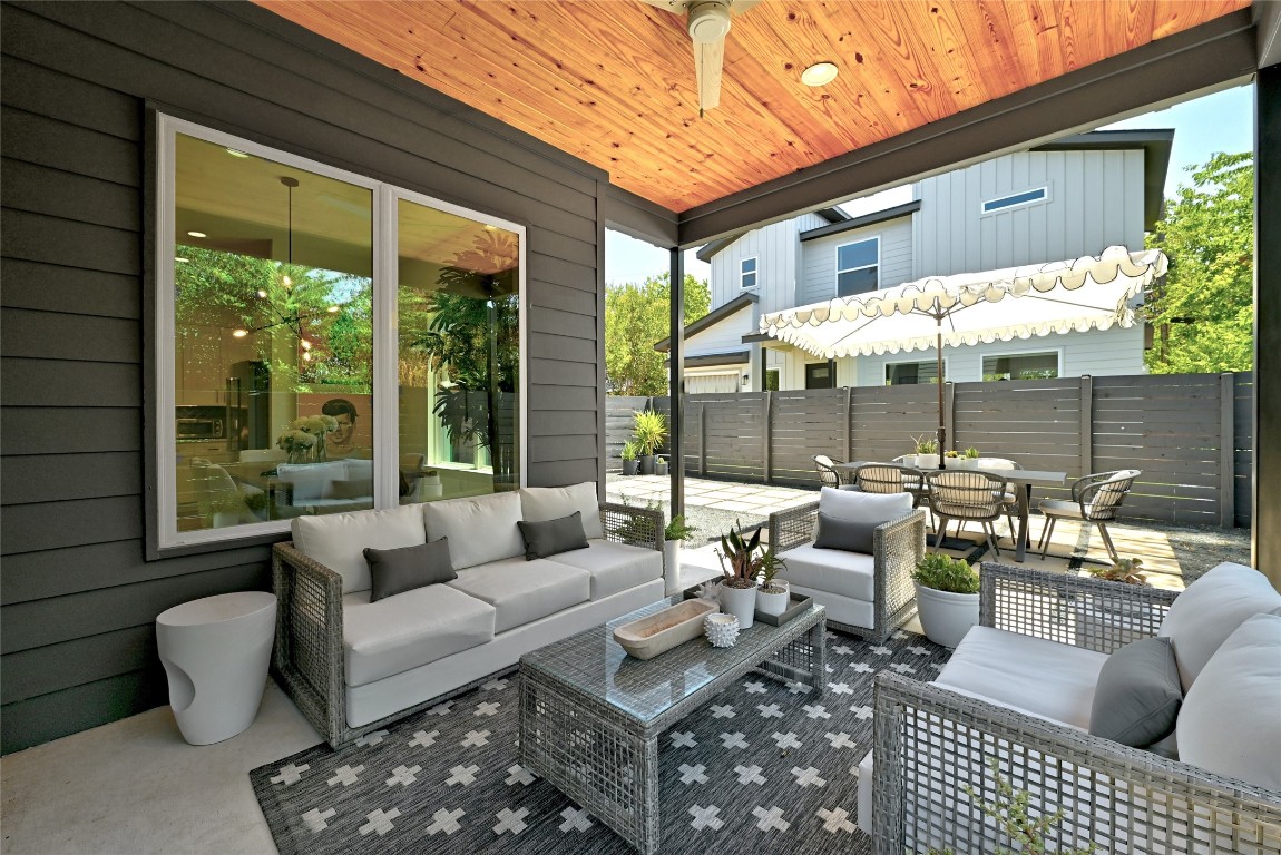 2909 Kuhlman Avenue, Unit 1 Austin, TX 78702 - Photo 37 of 40 a outdoor space with patio the couches and a dining table with the view of the balcony