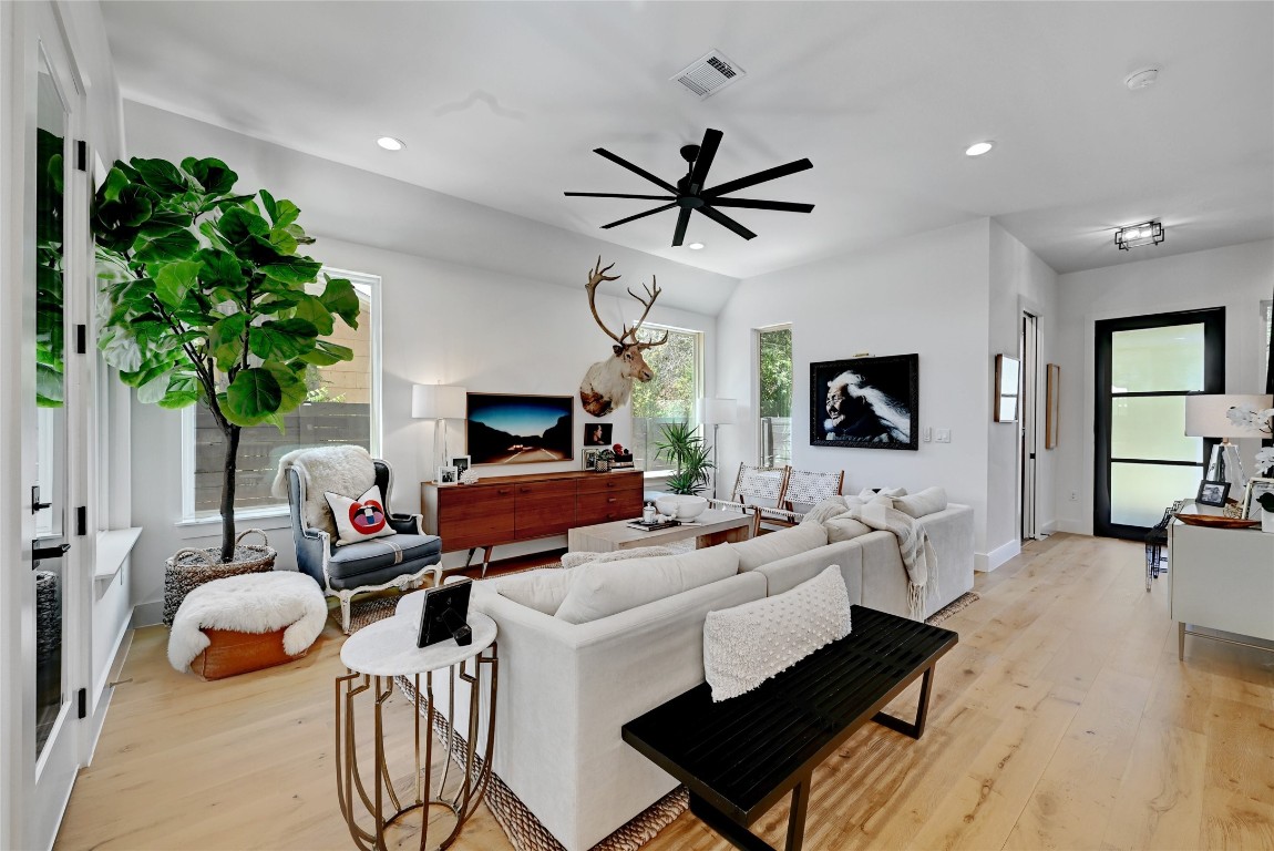 2909 Kuhlman Avenue, Unit 1 Austin, TX 78702 - Photo 4 of 40 a living room with furniture a flat screen tv and a potted plant