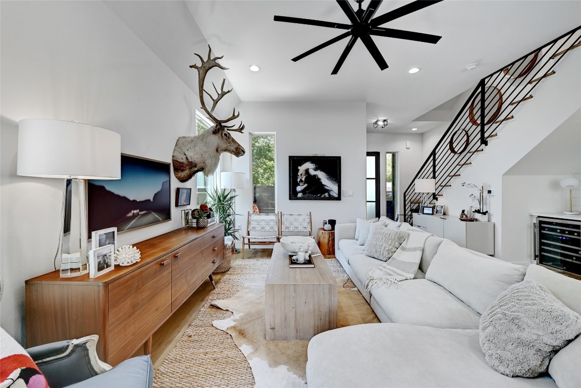 2909 Kuhlman Avenue, Unit 1 Austin, TX 78702 - Photo 5 of 40 a living room with furniture a chandelier and a flat screen tv