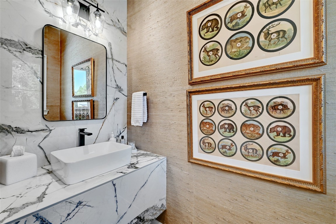 2909 Kuhlman Avenue, Unit 1 Austin, TX 78702 - Photo 9 of 40 a bathroom with a mirror and a sink