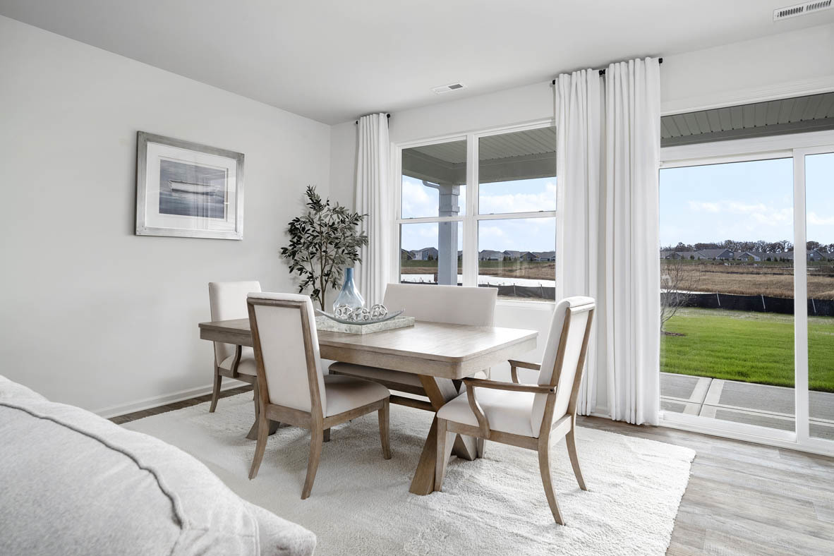 799 Mesa Lane Pingree Grove, IL 60140 - Photo 27 of 54 a view of a dining room with furniture window and wooden floor