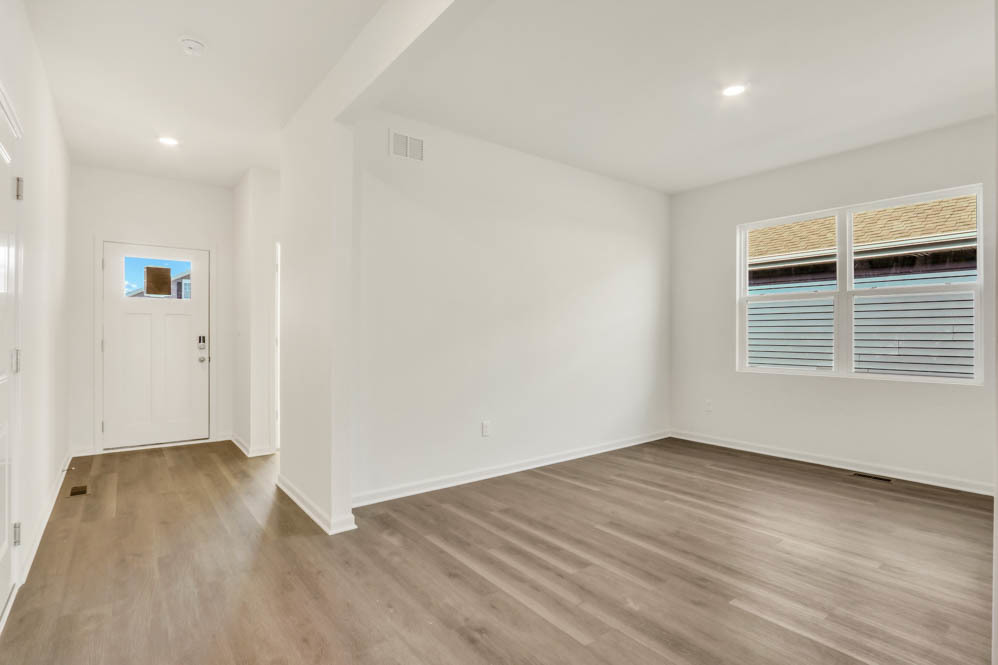 799 Mesa Lane Pingree Grove, IL 60140 - Photo 8 of 54 wooden floor in an empty room with a window