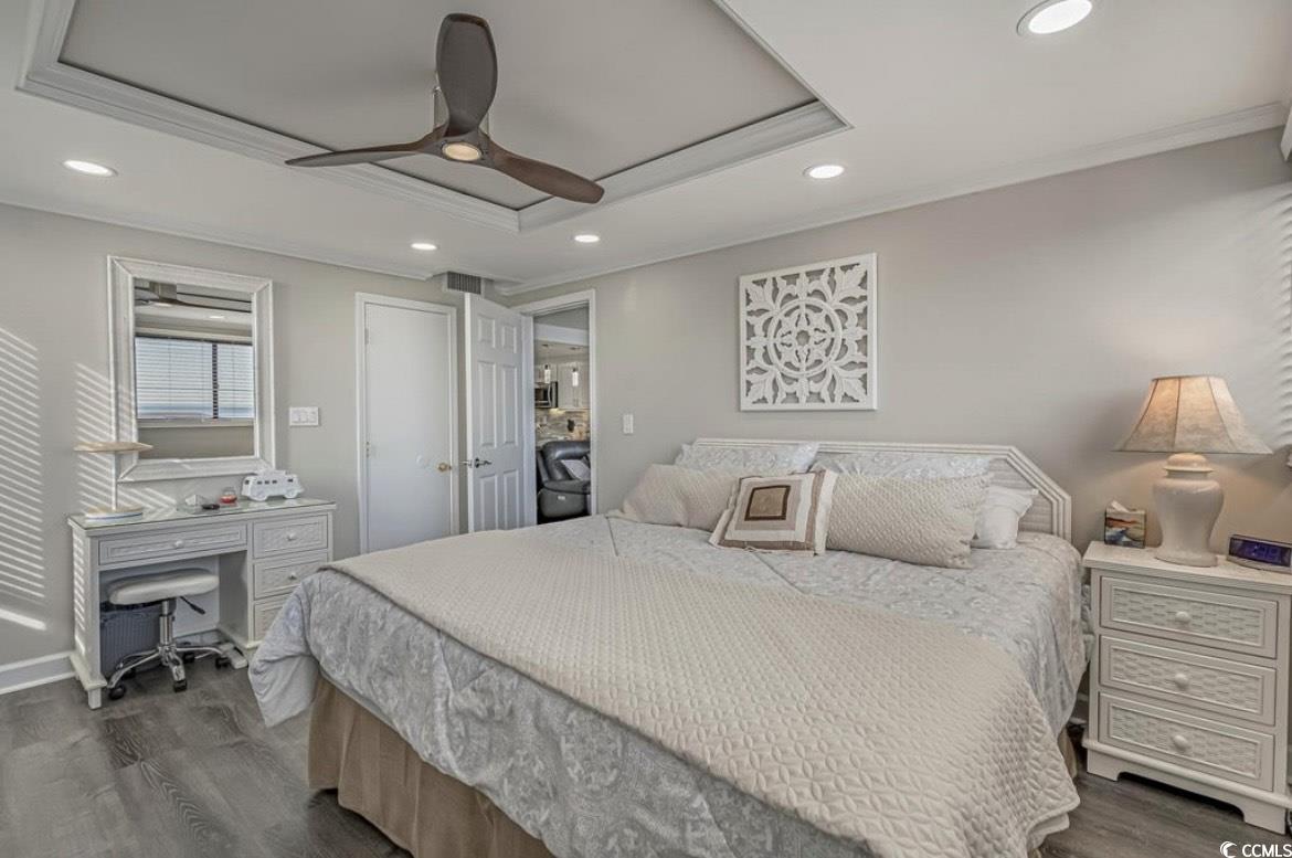 601 Mitchell Drive, Unit 1103 Myrtle Beach, SC 29577 - Photo 10 of 25 Bedroom with crown molding, recessed lighting, ceiling fan, dark wood-style floors, and a desk