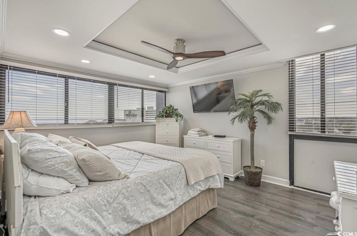 601 Mitchell Drive, Unit 1103 Myrtle Beach, SC 29577 - Photo 11 of 25 Bedroom featuring a raised ceiling, crown molding, dark wood-type flooring, recessed lighting, and ceiling fan