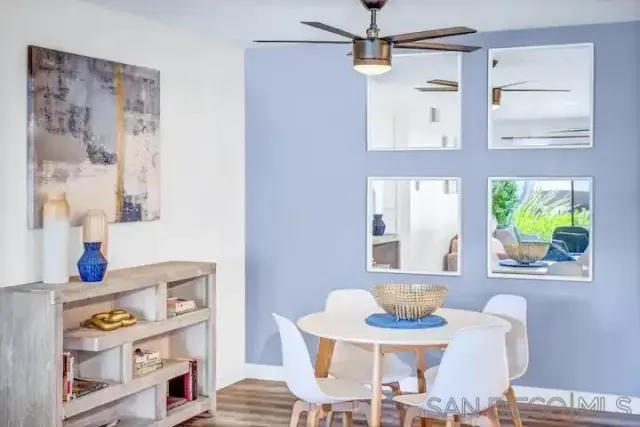 a dining room with furniture and window