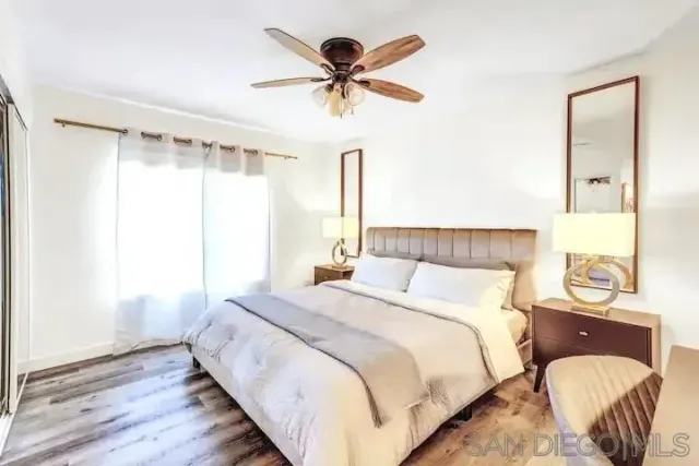 a bedroom with bed and a window