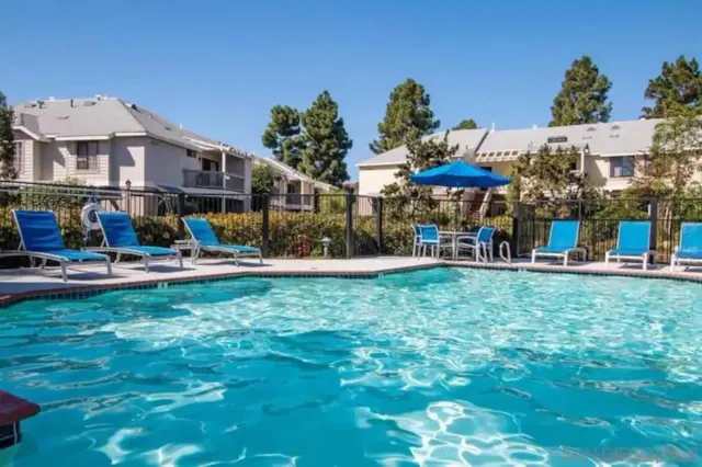 a front view of a building with a yard