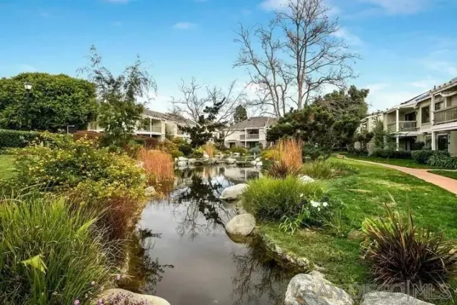 a view of a lake with a building in the background