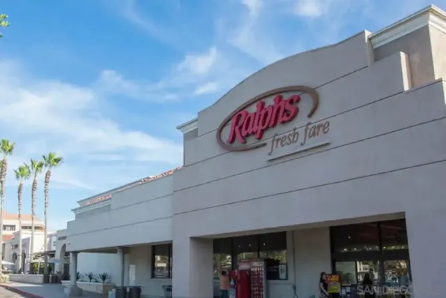 a view of a street with paintings on the wall