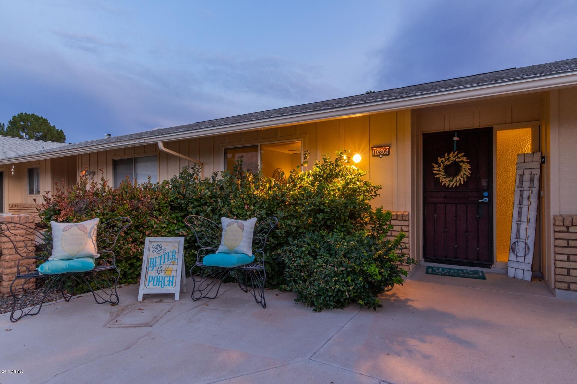 10805 West Hatcher Road Sun City, AZ 85351 - Photo 3 of 46 Front patio night