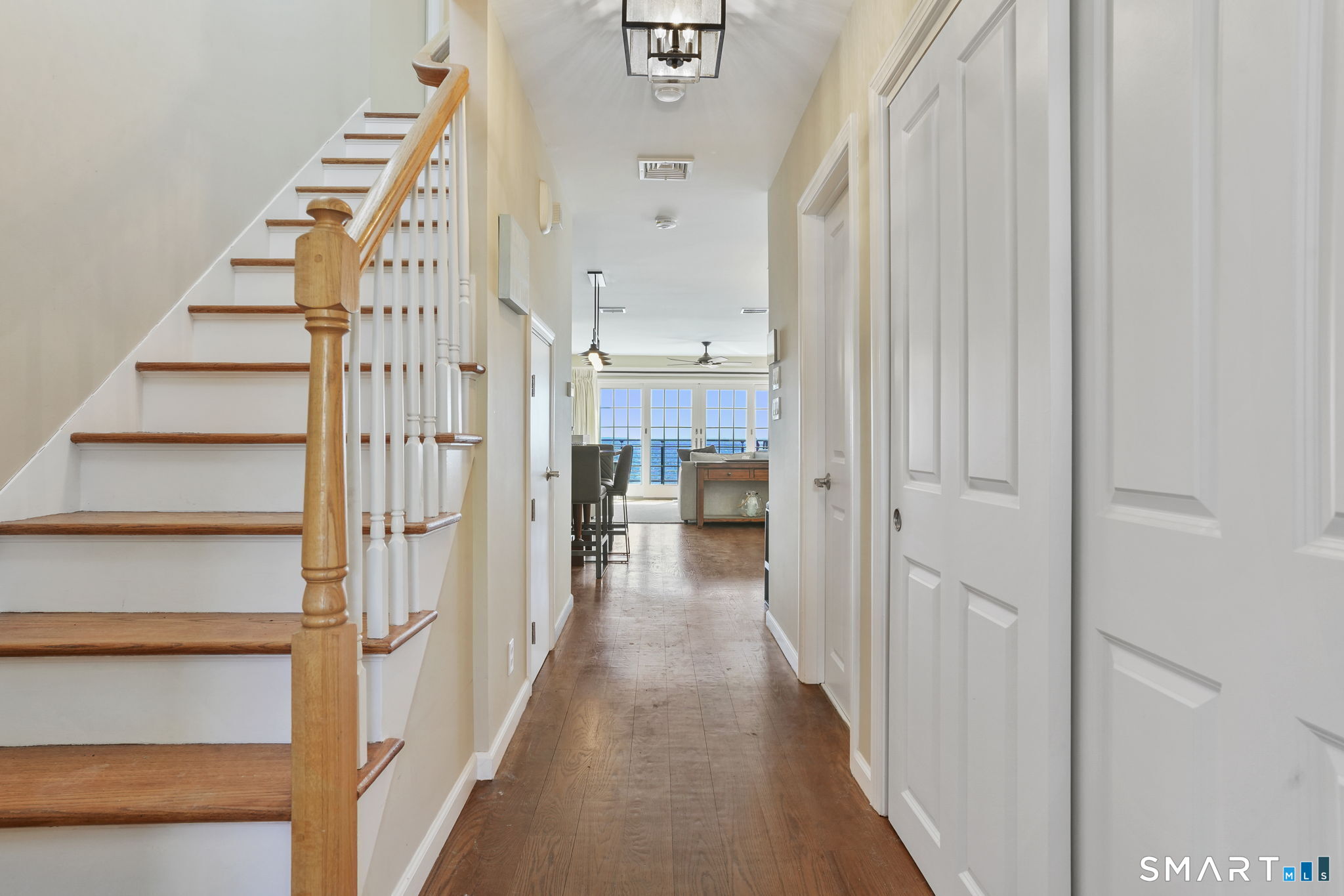 40 Pond Road Old Lyme, CT 06371 - Photo 10 of 35 a view of a hallway with wooden floor and staircase