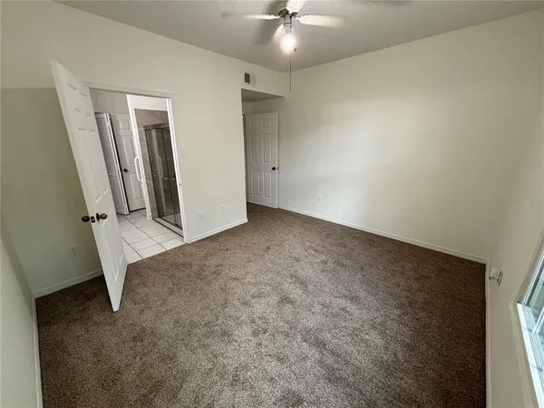 an empty room with a bathroom