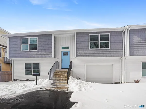 a house with trees in the background