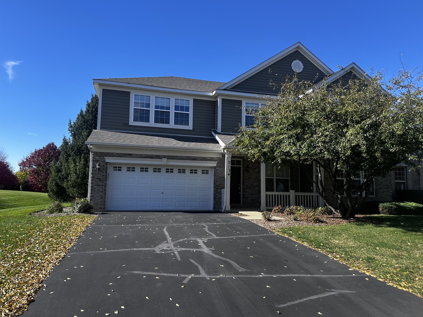 3134 Kyra Lane Elgin, IL 60124 - Photo 1 of 56 a front view of a house with a garden