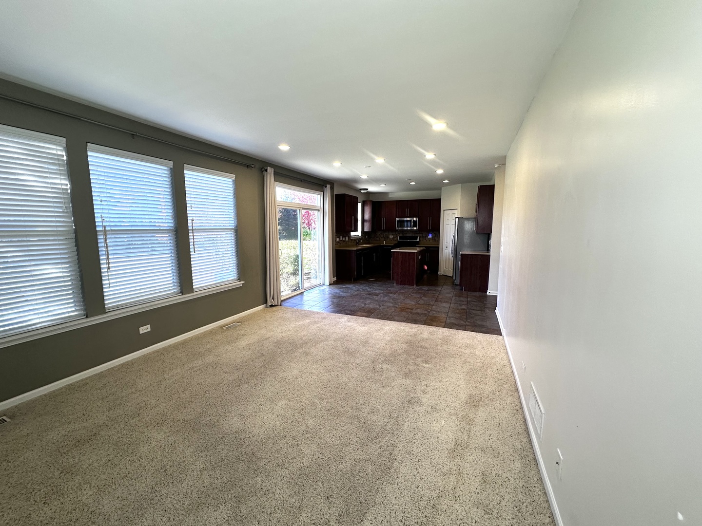 3134 Kyra Lane Elgin, IL 60124 - Photo 19 of 56 an empty room with furniture and a large window