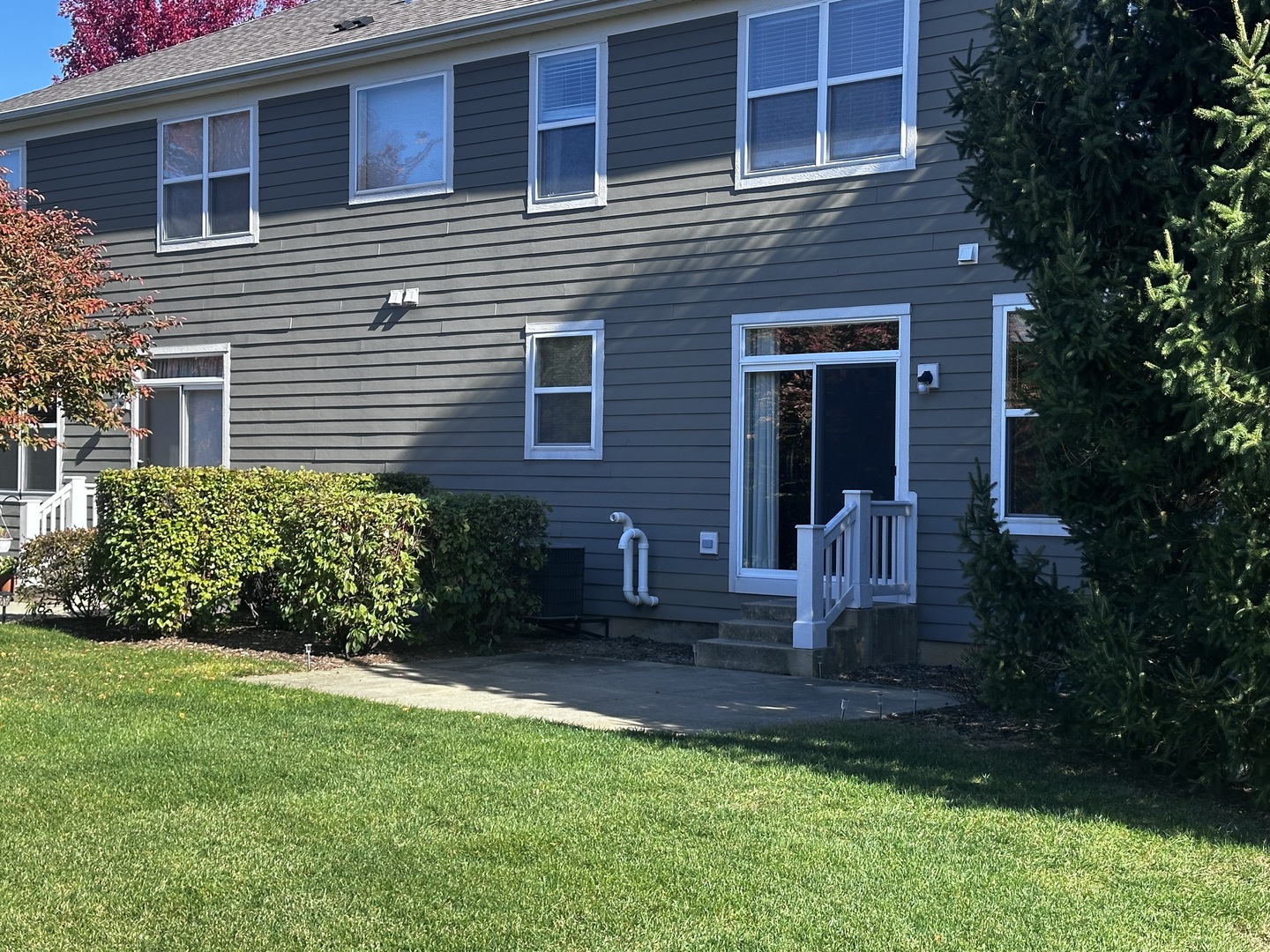 3134 Kyra Lane Elgin, IL 60124 - Photo 53 of 56 a view of a brick house with a yard and plants
