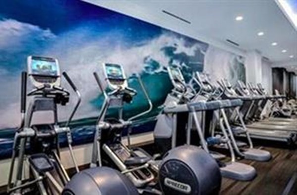 580 Washington Street, Unit 404 Boston, MA 02111 - Photo 29 of 34 a room with gym equipment