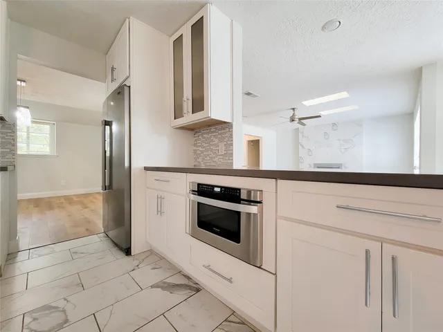 a kitchen with a stove and a refrigerator