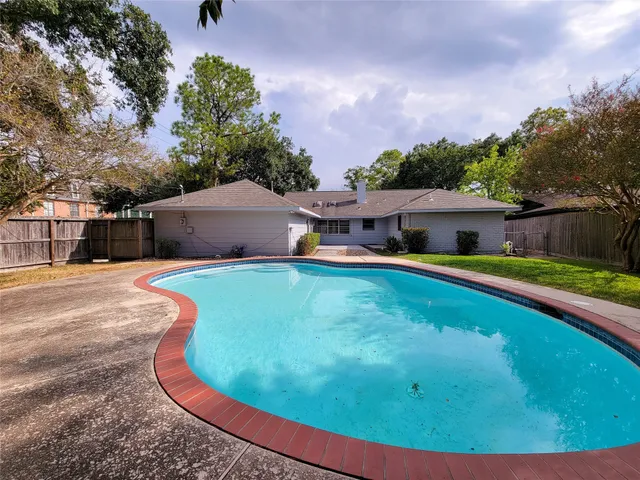 a view of a house with swimming pool