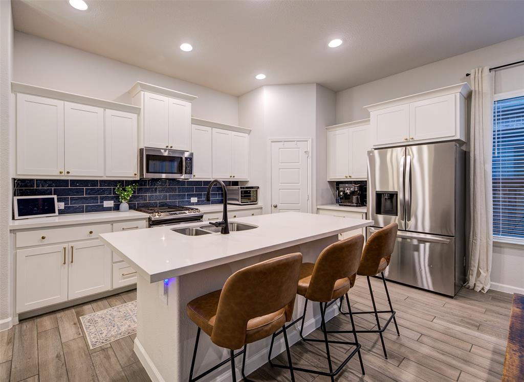 162 Palo Duro Bend Rhome, TX 76078 - Photo 8 of 25 Gorgeous Kitchen with large island and coffee bar area