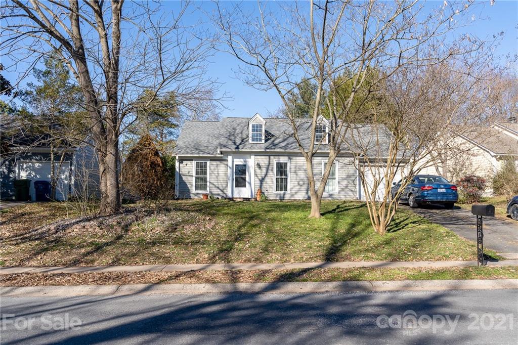12232 Danby Road Pineville, NC 28134 - Photo 2 of 15 a view of a yard with a house and a tree