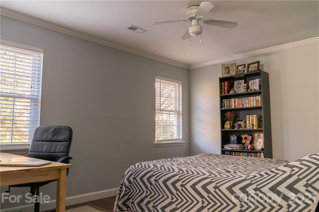 12232 Danby Road Pineville, NC 28134 - Photo 11 of 15 a bedroom with a bed and a window