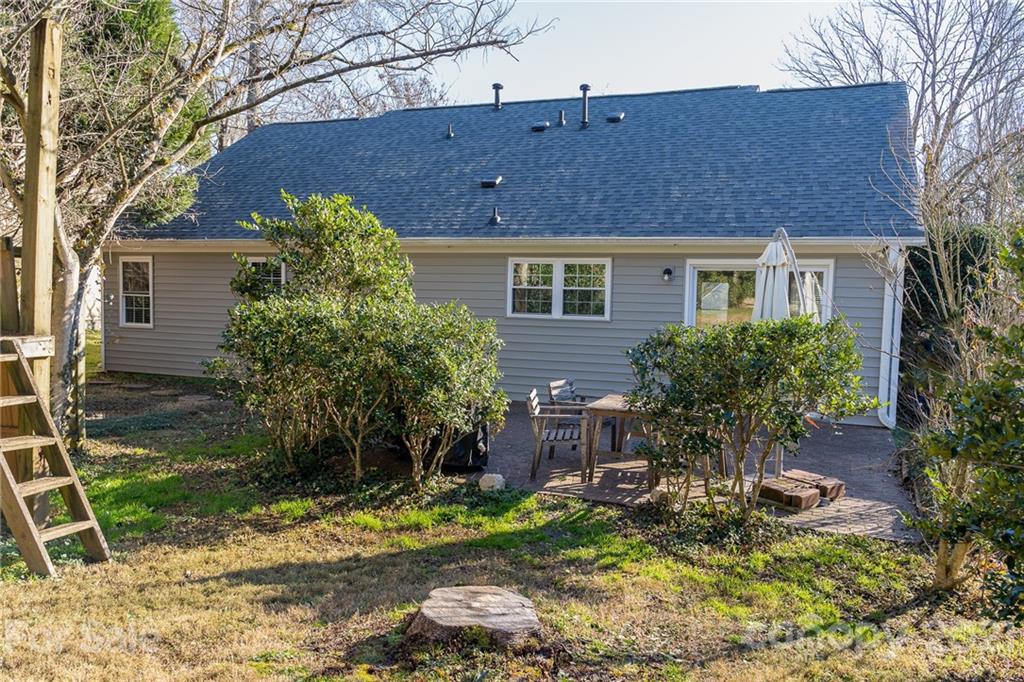12232 Danby Road Pineville, NC 28134 - Photo 15 of 15 a backyard of a house with yard and outdoor seating