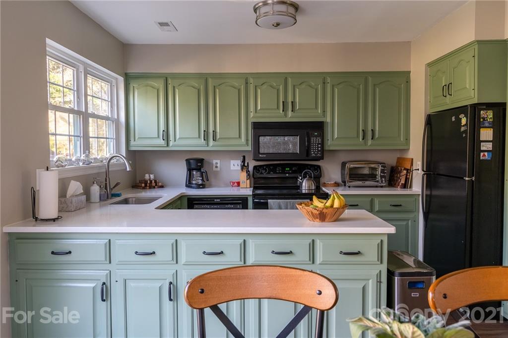 12232 Danby Road Pineville, NC 28134 - Photo 8 of 15 a kitchen with a refrigerator stove and microwave