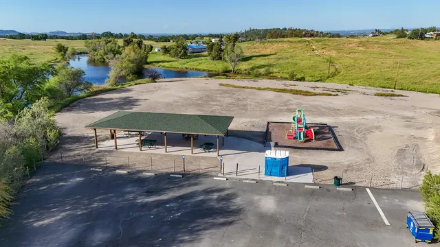 an aerial view of a house with a lake view
